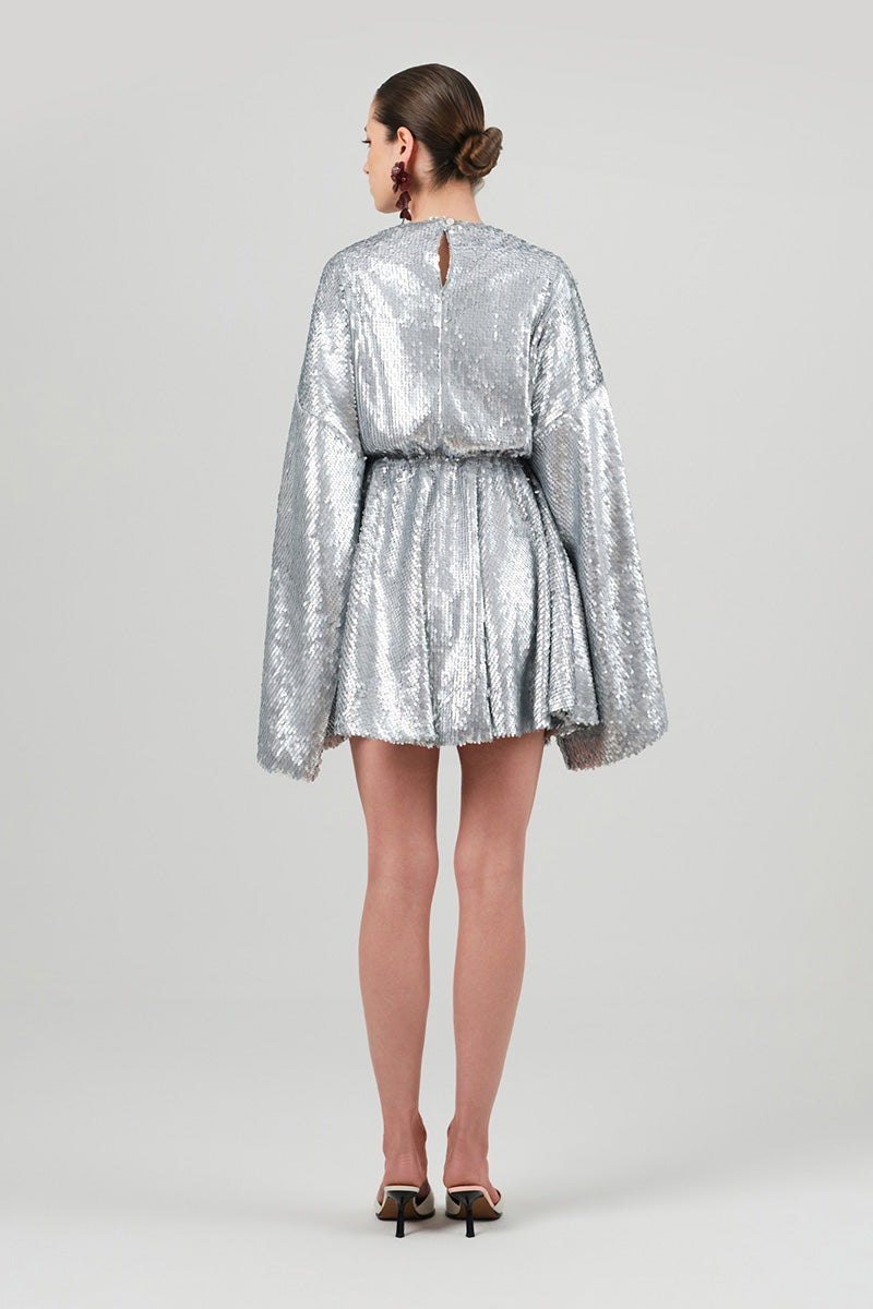 Izakova Nina silver sequin mini dress with long sleeves and fitted silhouette, perfect for evening or party wear.