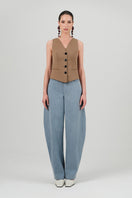 Izakova washed blue jeans, slim fit style, with classic five-pocket design and distressed detailing on the denim fabric.