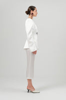 Izakova REA satin white pants featuring a sleek, smooth fabric with a tailored fit and stylish design.