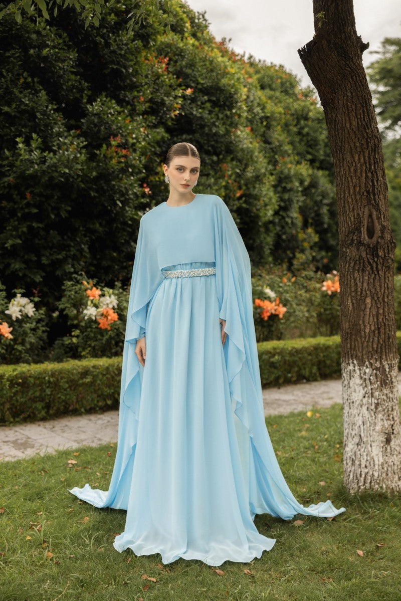 Elegant ANAIS chiffon gown by 21Six featuring flowing fabric and intricate detailing, displayed on a mannequin.