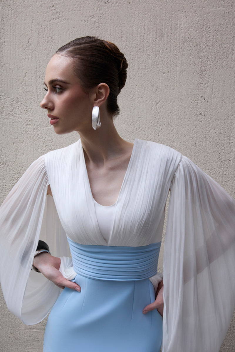 Elegant white and blue Duchess gown by Jenny K Tran featuring flowing fabric and intricate design details.
