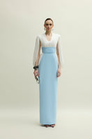 Elegant white and blue Duchess gown by Jenny K Tran featuring intricate detailing and flowing fabric.