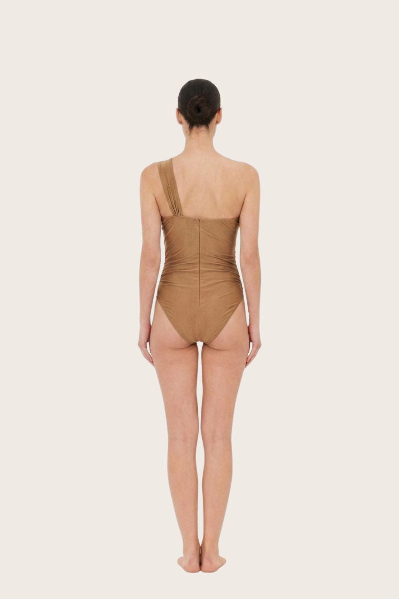 Aguaclara Dune one-shoulder one-piece swimsuit with a sleek design, shown in a front view on a model against a neutral background.