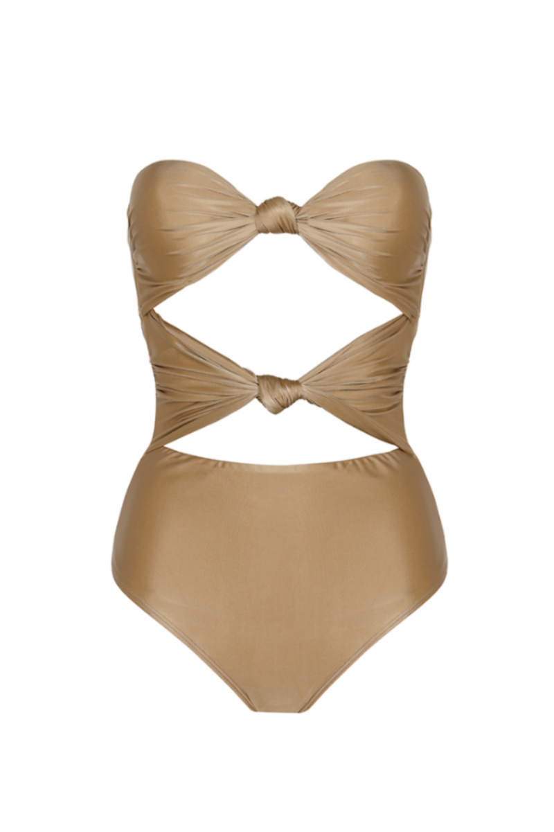 Aguaclara Dune one-piece swimsuit with a sleek design, featuring a fitted silhouette and stylish straps on a white background.