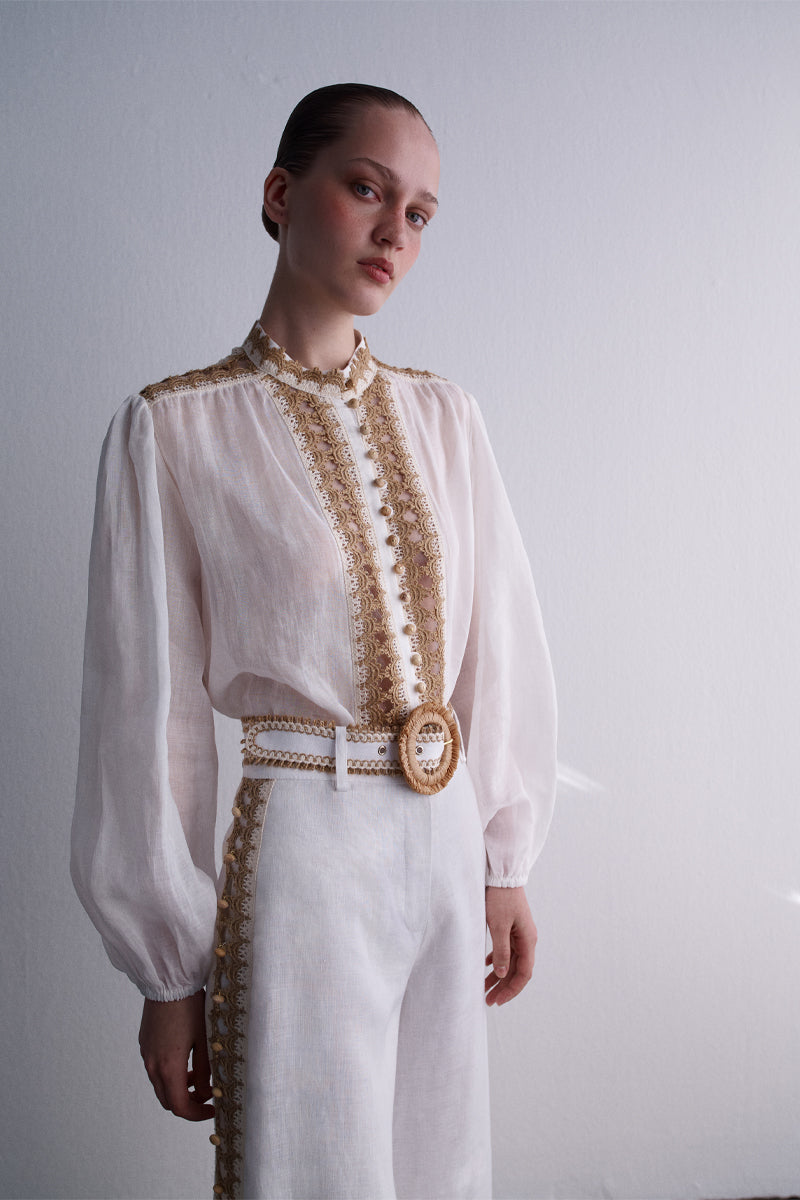 A pair of white natural Dune pants by AISA with a relaxed fit, displayed flat on a white background.