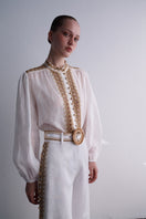 A pair of white natural AISA Dune pants with a relaxed fit, featuring a comfortable waistband and stylish design.
