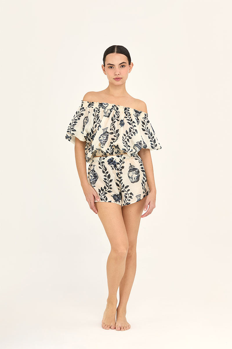 Aguaclara Dynasty short in black, lightweight fabric, with a relaxed fit, displayed flat on a white background.