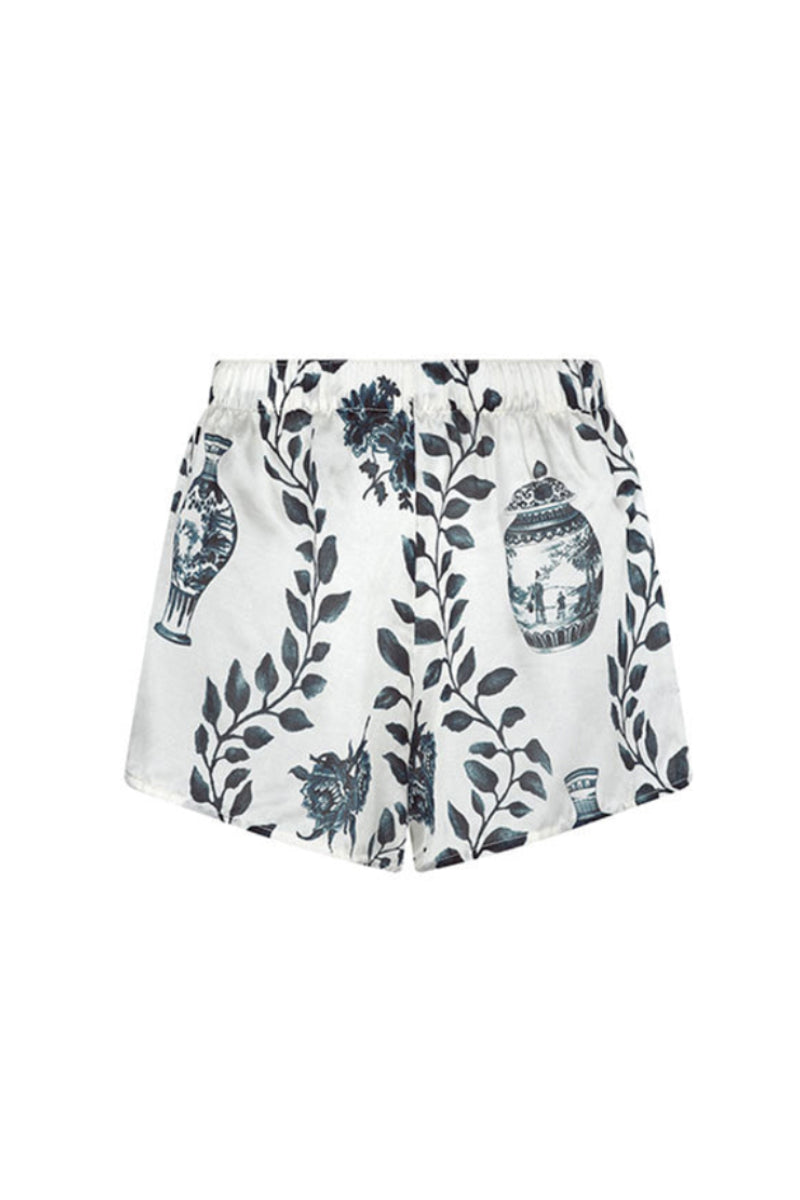 Aguaclara Dynastie shorts in light fabric, displayed flat with a drawstring waistband and casual fit, ideal for summer wear.