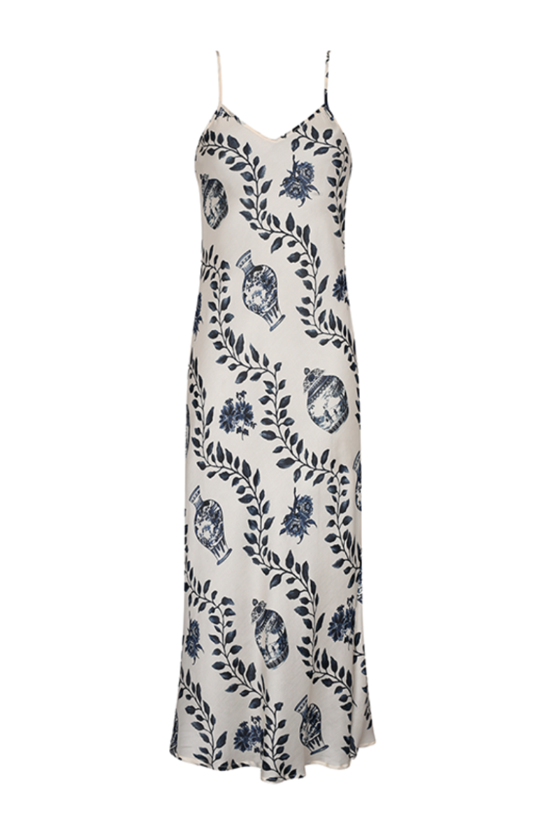 Auguaclara Dynastie midi slip dress in soft fabric, featuring a flowing silhouette and delicate straps, laid flat on a neutral background.
