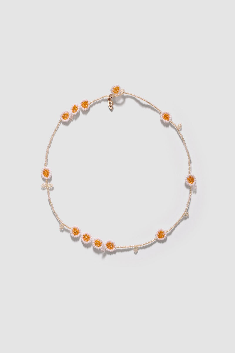 Pura Utz Daisy Flower Field Necklace featuring a delicate chain and pendant with a vibrant daisy flower design.