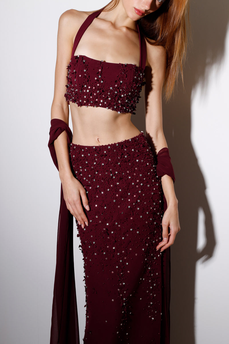 Burgundy Rayane Bacha Dalya embellished halter co-ord set featuring intricate beadwork and a stylish halter design.