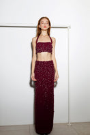 Rayane Bacha Dalya embellished halter co-ords set in rich burgundy with intricate beadwork and stylish halter neckline.