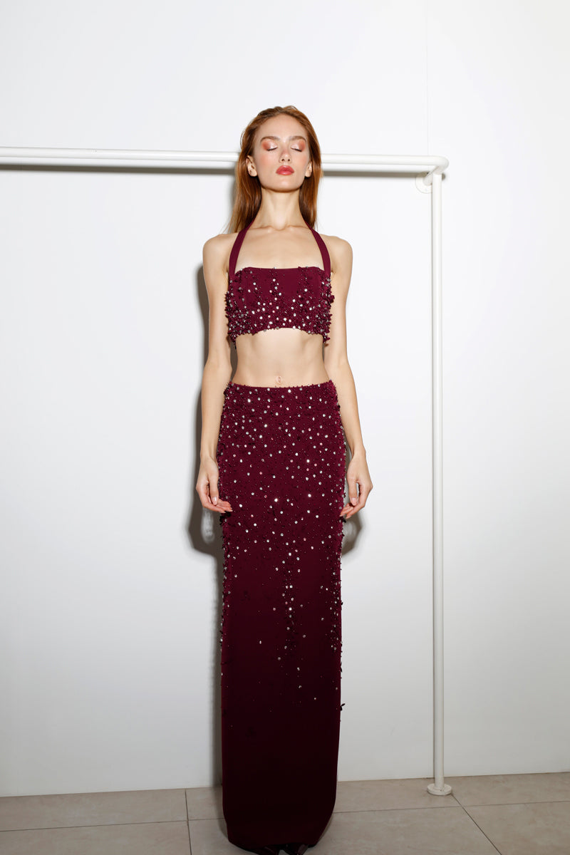 Rayane Bacha Dalya embellished halter co-ords set in rich burgundy with intricate beadwork and stylish halter neckline.