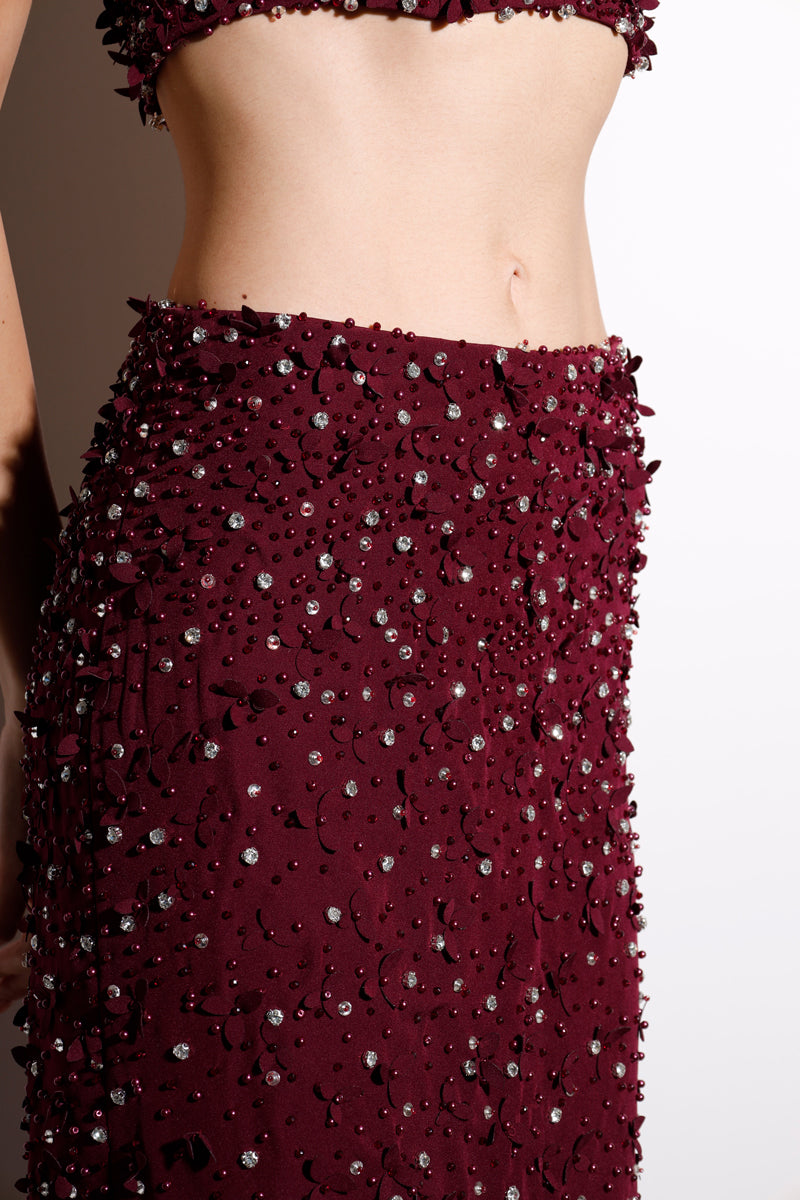 Burgundy Rayane Bacha Dalya embellished halter co-ord set with intricate beadwork and a fitted halter top and matching pants.