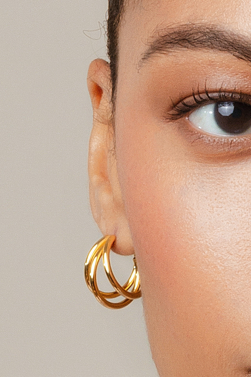 Close-up of Sara Shala Dani Maxi Earrings in yellow gold vermeil, showcasing their elegant, bold design and shiny finish.