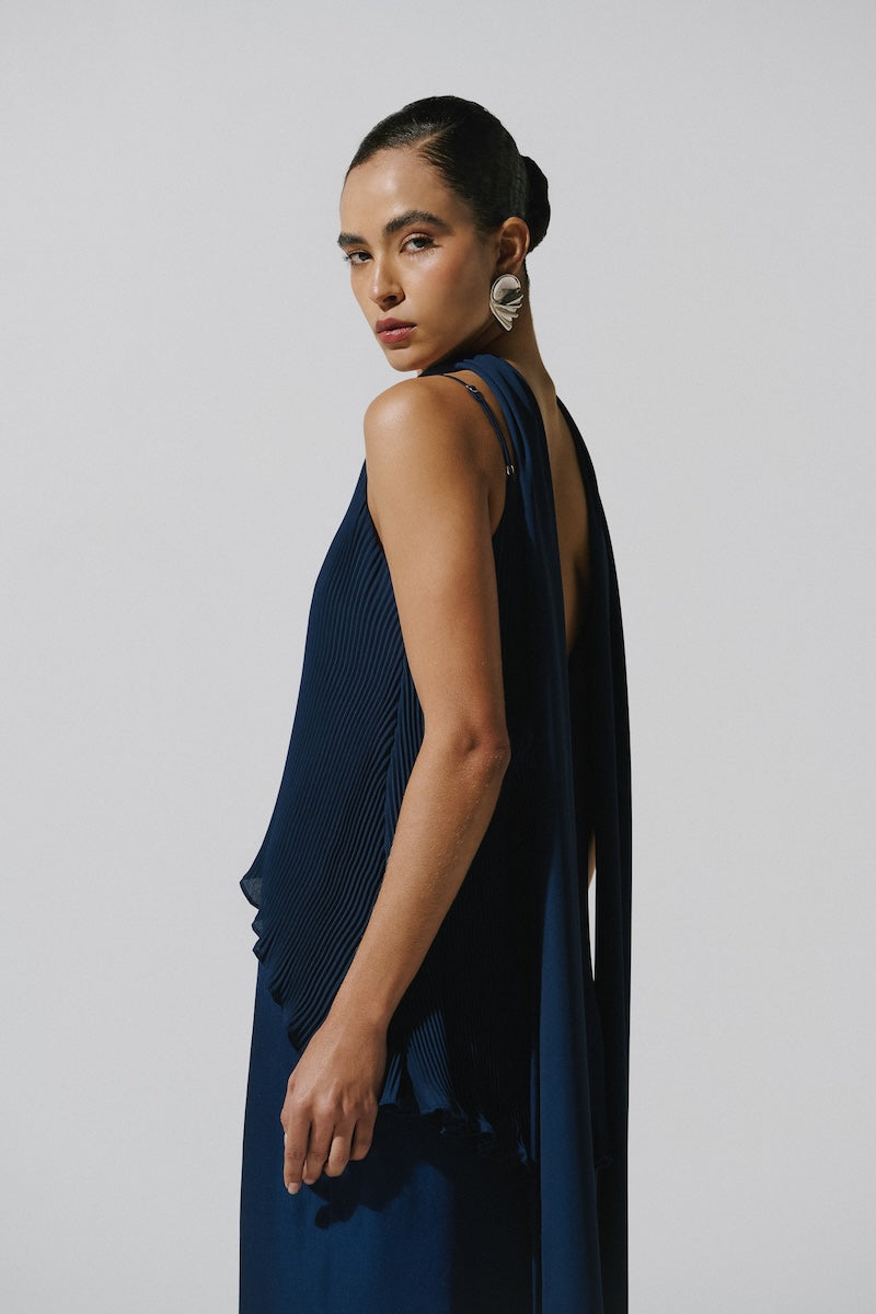 Night blue Baobab Danielle maxi dress displayed on a hanger, showcasing flowing fabric and elegant design.