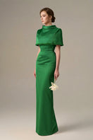 Dark green taffeta gown by I.H.F featuring a cropped cape and inverted lapel, elegant formal dress with sophisticated detailing.
