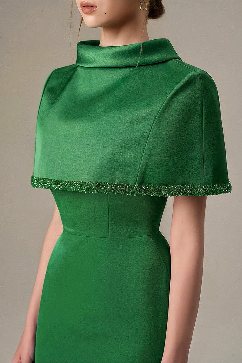 Dark green taffeta maxi dress with a cropped cape and inverted lapel by I.H.F, shown on a model.