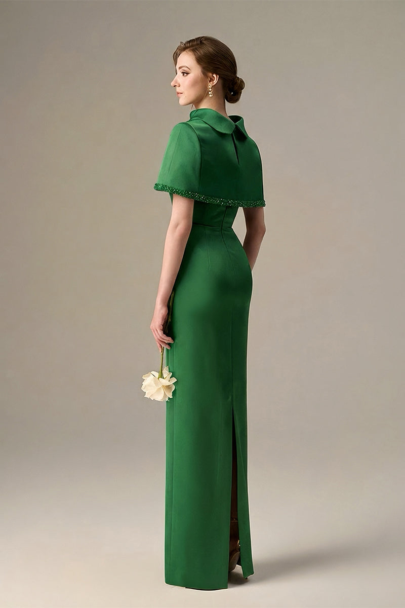 Dark green taffeta maxi dress with a cropped cape and inverted lapel, by I.H.F, styled for elegant occasions.
