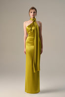 Dark yellow satin halter gown by I.H.F with cross detail and pleated drape, showcasing elegant evening wear.