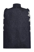 Nadya Shah IRIS denim cape jacket shown from the back in dark denim with wide sleeves and stylish design.