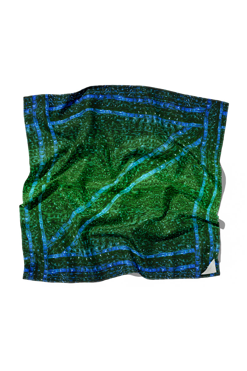 Amel Batita Darq Brocot silk scarf featuring intricate brocade pattern and vibrant colors, draped to showcase elegant design.