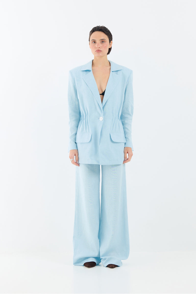 Tamar Keburia Deborah blazer in baby blue, stylish tailored blazer with a slim fit and classic lapel, displayed on a hanger.