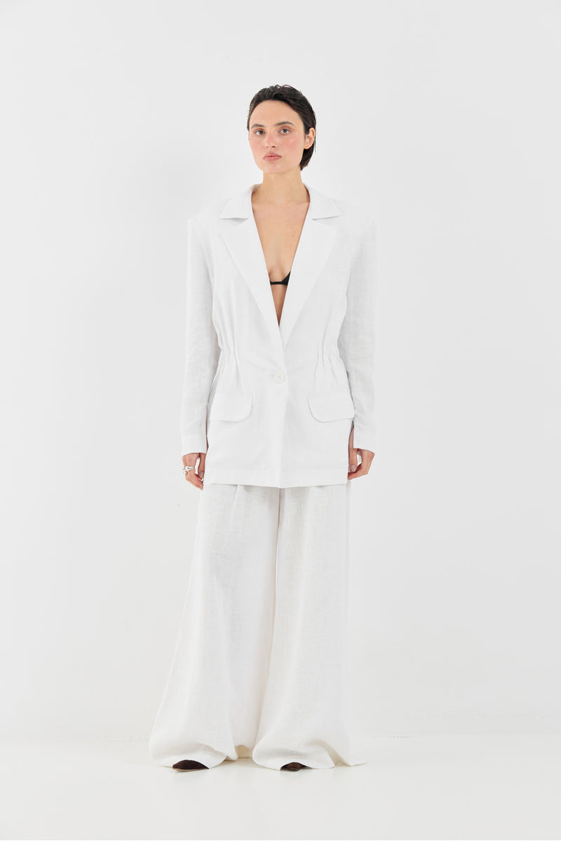 White Deborah pants by Tamar Keburia featuring a tailored fit and stylish design, shown on a model.