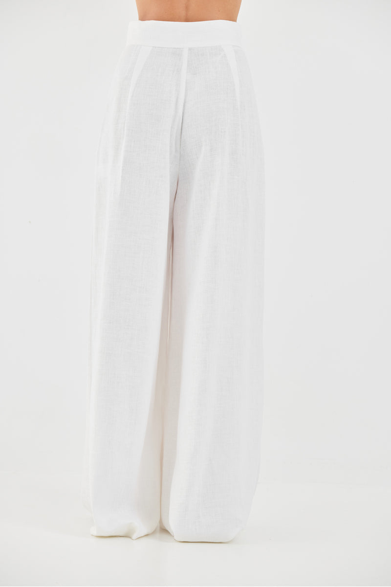 White Deborah pants by Tamar Keburia showing a tailored fit and clean design on a neutral background.