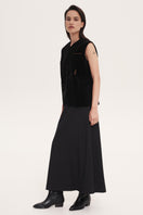 Black rose embroidered vest by DELEGAN, featuring intricate floral embroidery and a stylish sleeveless design.
