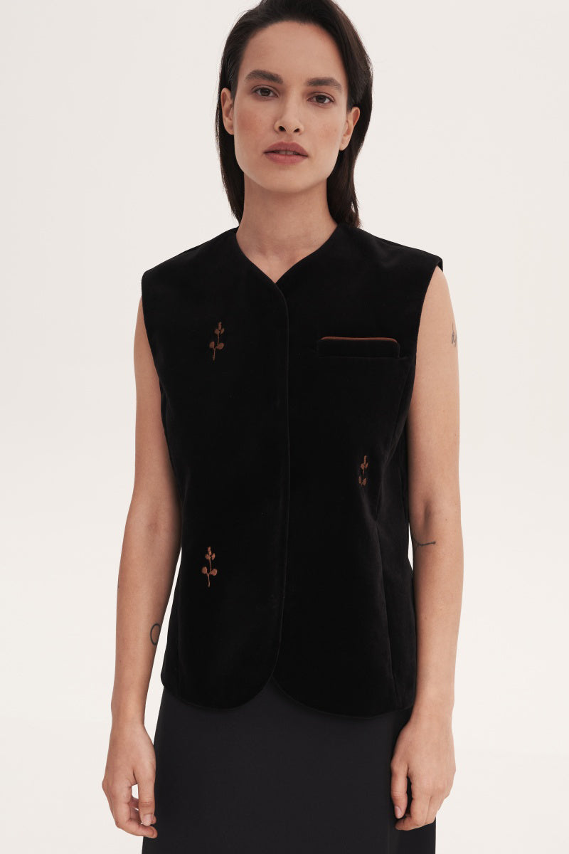 Black rose embroidered vest by Delegan, featuring detailed floral embroidery and a stylish, contemporary design.