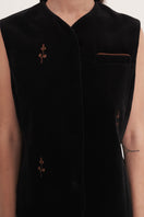 Black rose embroidered vest by Delegan, featuring detailed floral embroidery and a stylish fit, perfect for layering.