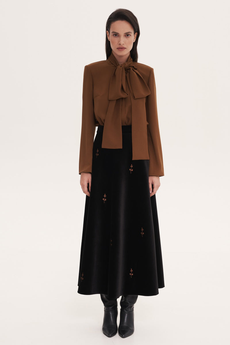 Brown Delegan blouse with a matching scarf accessory, featuring long sleeves and a relaxed fit.
