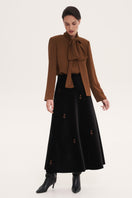 Brown blouse with scarf accessory from DELEGAN, featuring a stylish shirt design and elegant neckline.