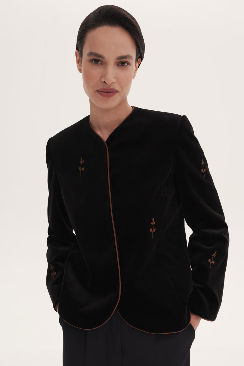 Black rose embroidered jacket by Delegan, stylish outerwear with intricate floral embroidery and a modern fit.