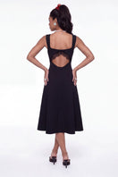 Nana Jacqueline Delilah black midi dress with cut-out design, stylish and elegant for fashionable occasions.