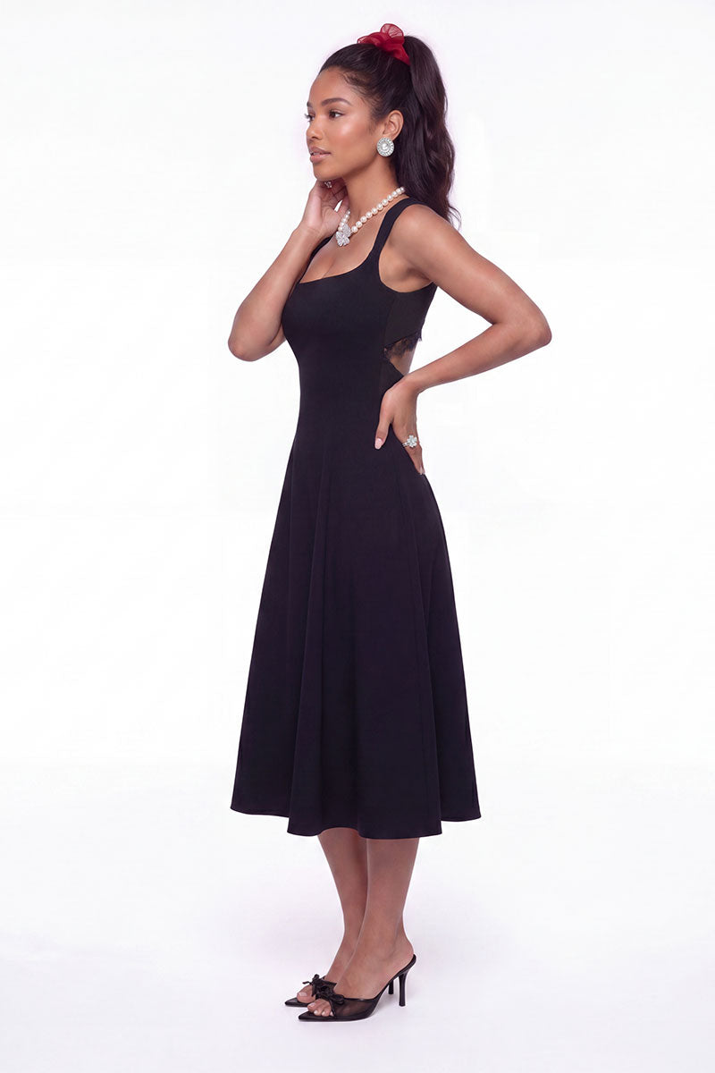 Black Nana Jacqueline Delilah midi dress with cut-out design, shown on a model in a stylish lookbook setting.
