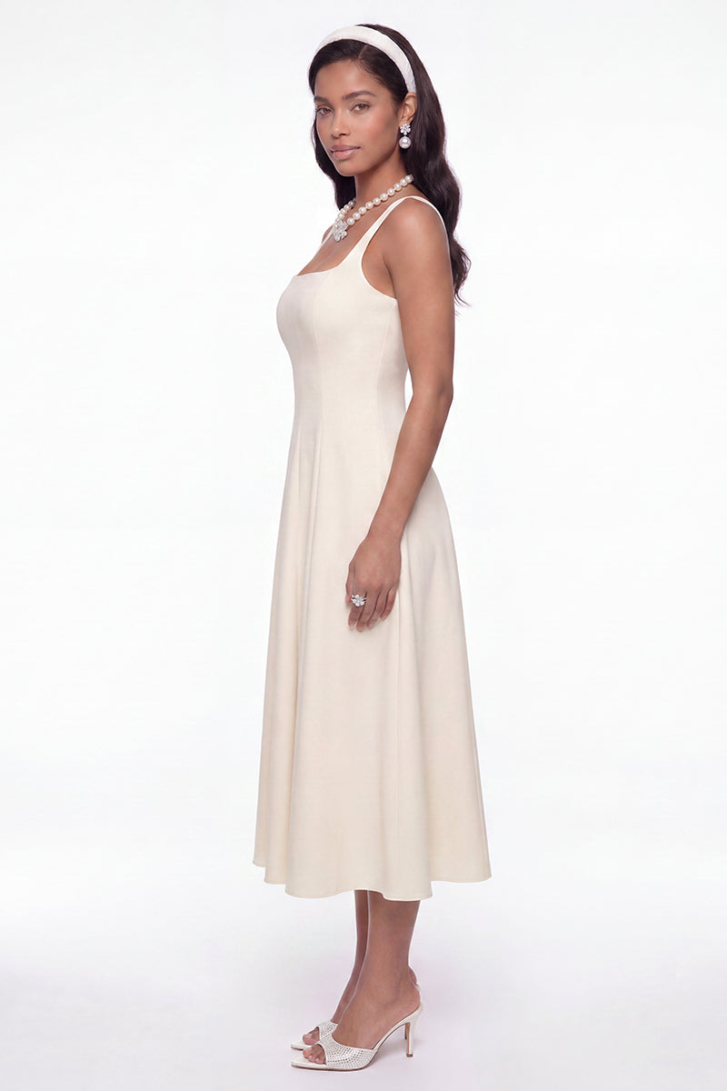 White Delilah midi dress by Nana Jacqueline featuring cut-out design and elegant style, shown on a model in the Champagne lookbook.