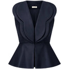 Navy blue DELLA top by ANA + MARIA displayed on a ghost mannequin, showcasing a stylish sleeveless blouse with a high neckline.