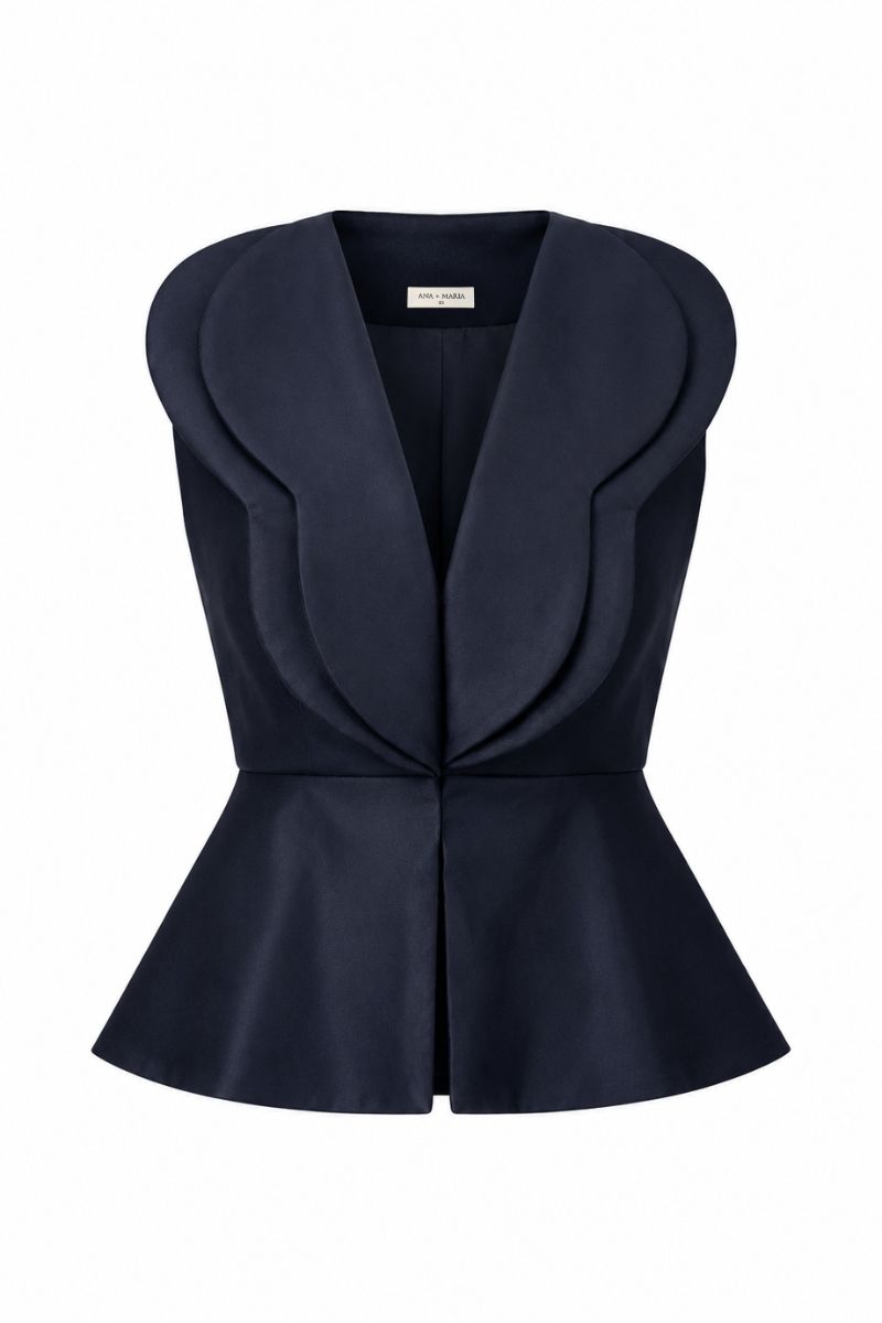 Navy blue Della top by ANA + MARIA displayed on ghost mannequin, showcasing its stylish design and fabric texture.