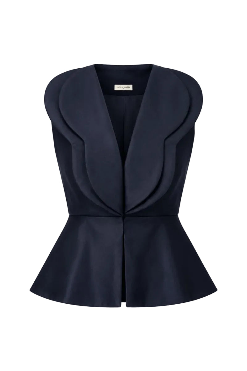Navy blue Della top by ANA + MARIA displayed on ghost mannequin, showcasing its stylish design and fabric texture.