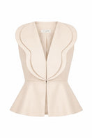 Cream-colored Della Top by Ana + Maria displayed on a mannequin, showcasing a stylish sleeveless top in a sand tone.