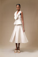 Light beige Della Top by ANA + MARIA, featuring a relaxed fit and soft fabric, styled in a casual top image.