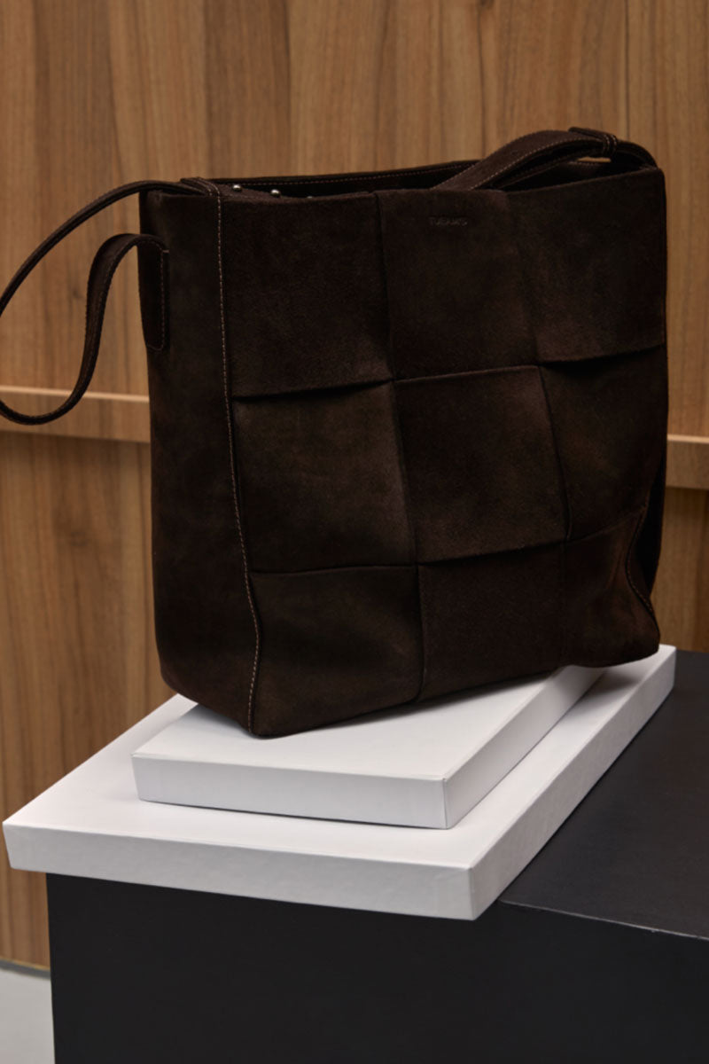 Brown suede Della Shopper shoulder bag by TUEAM'S with double handles and spacious interior, stylish for everyday use.