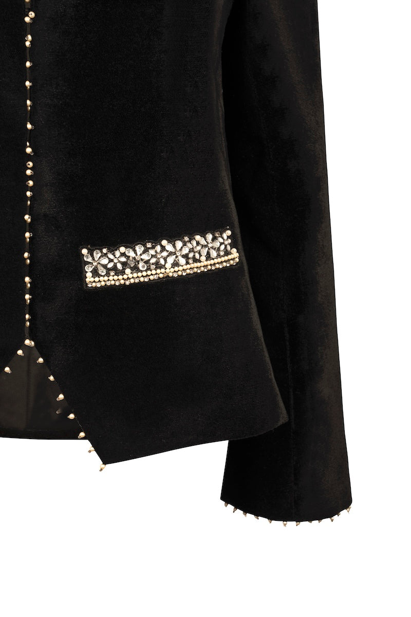 Nadya Shah Delphine Velvet Jacket shown on a mannequin with side detail, featuring rich velvet fabric and tailored design.