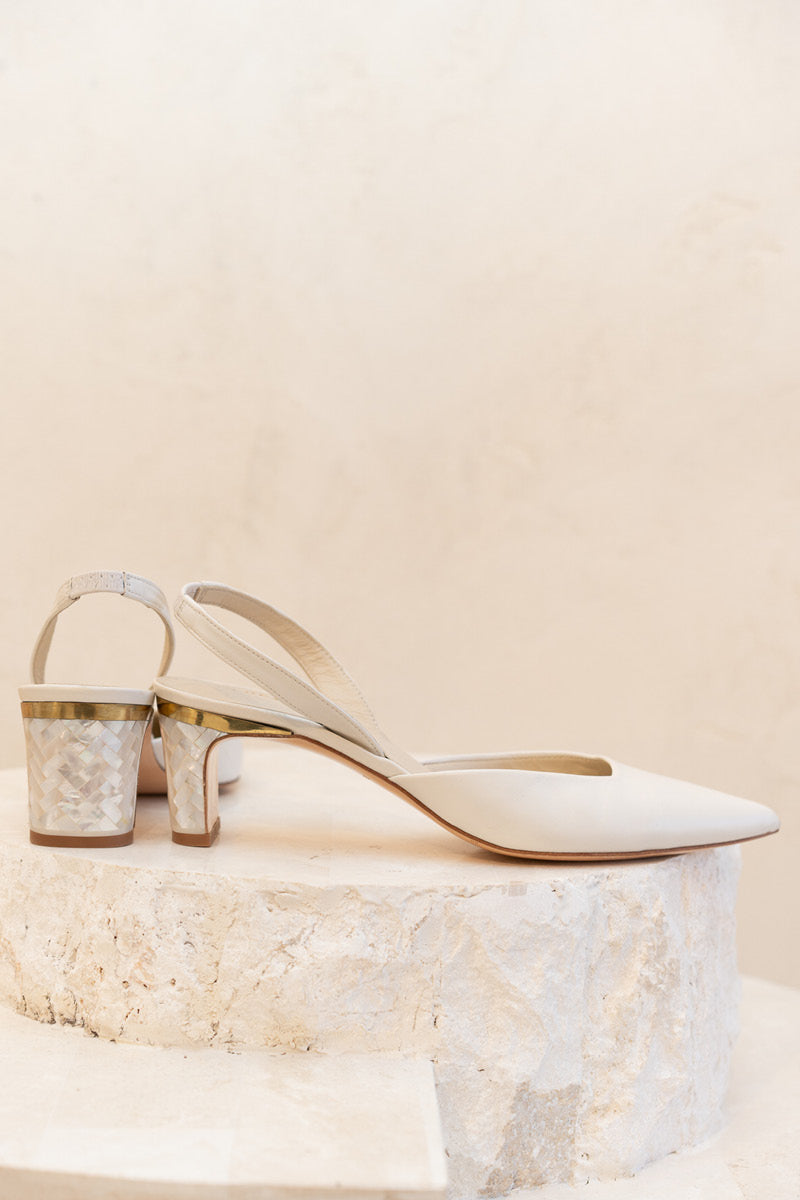 Ivory Delphine leather pearl heels by Freya Rose featuring elegant straps and decorative pearl accents.