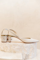 Ivory Delphine leather pearl heels by Freya Rose, featuring elegant design with leather straps and pearl embellishments.