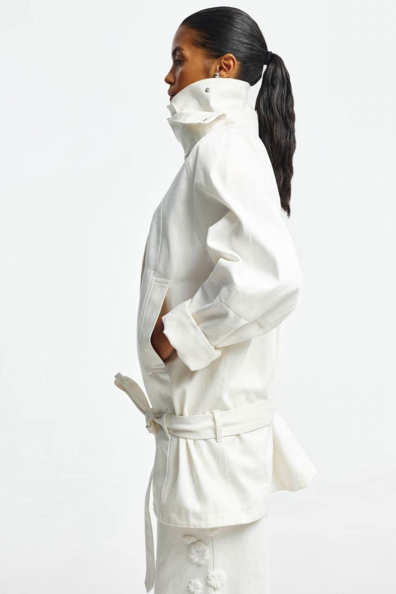 White denim jacket from Santa Brands, featuring classic styling and visible button details, perfect for casual wear.