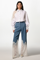 Liya Denim Bloom Trousers, stylish blue jeans with a floral embroidery design, fitted with a classic five-pocket style.