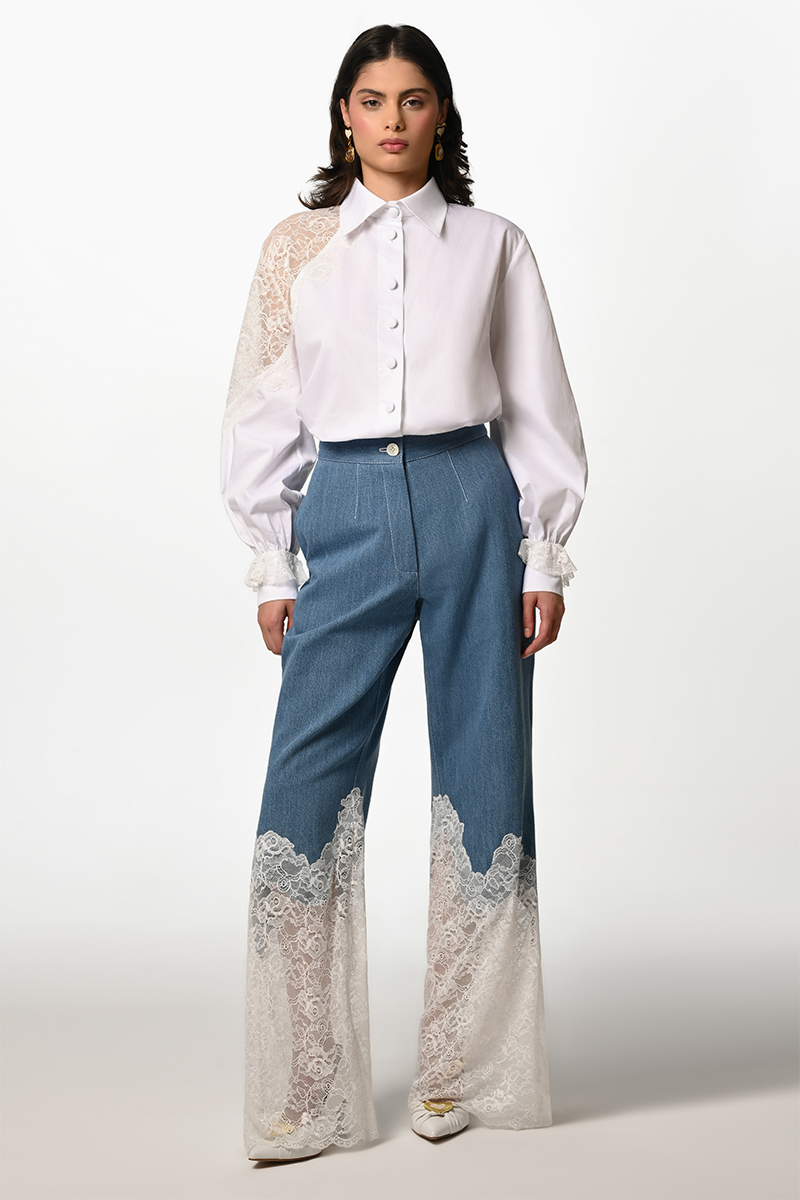 Liya Denim Bloom Trousers, stylish blue jeans with a floral embroidery design, fitted with a classic five-pocket style.